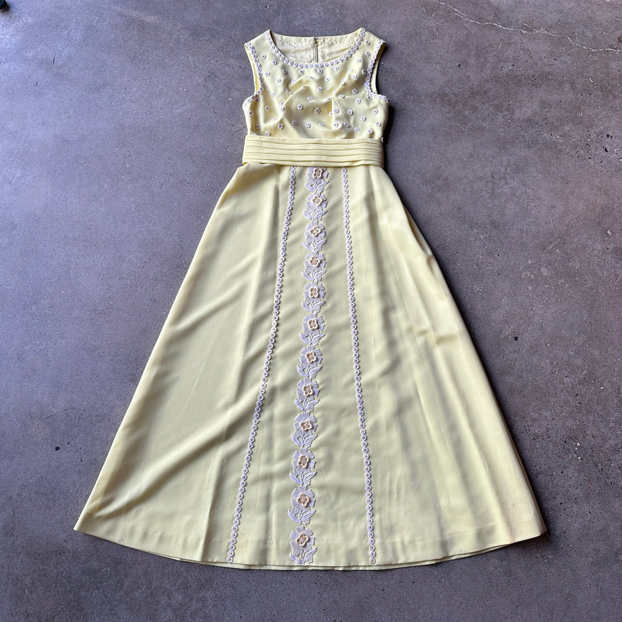 Yellow formal dress with white flower