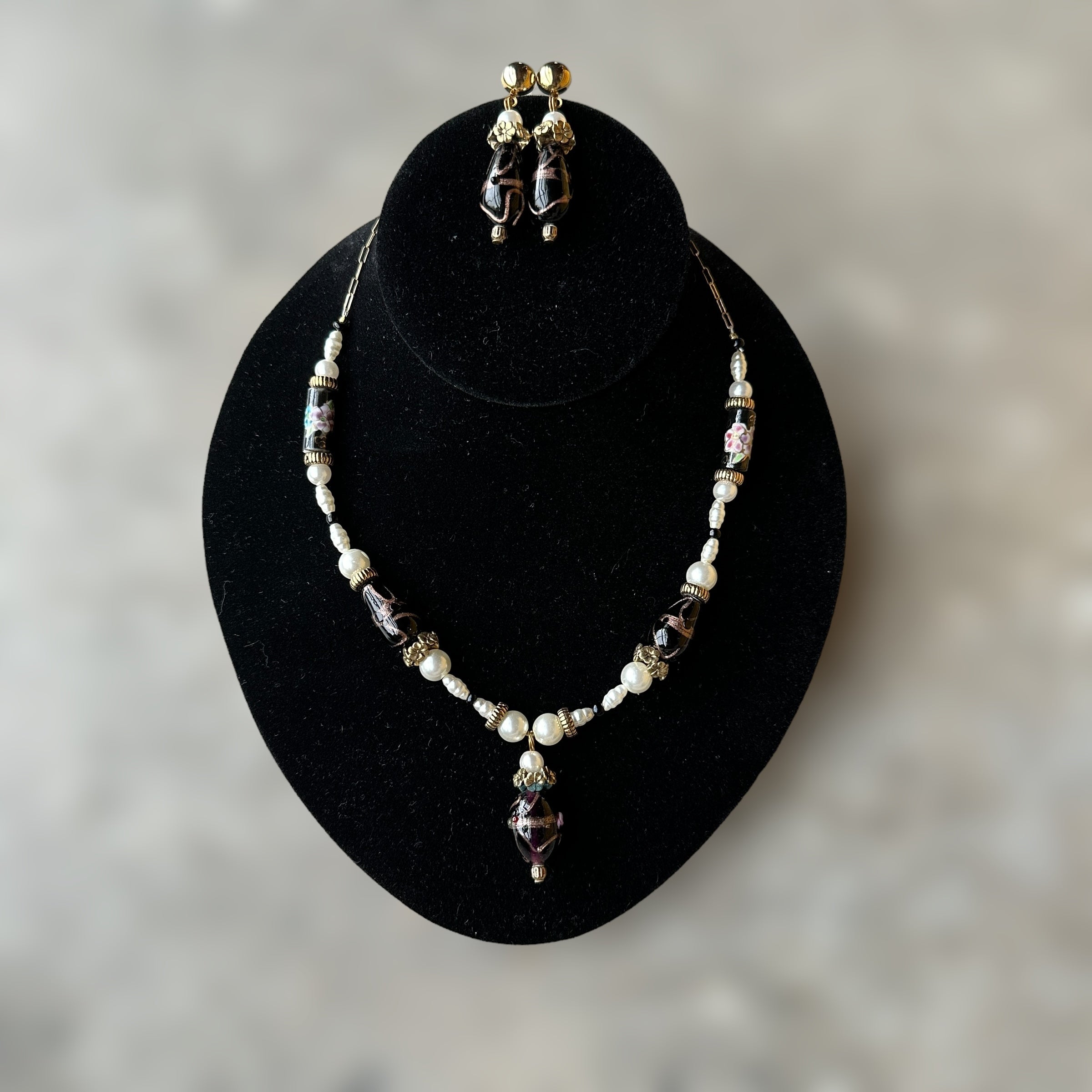 vintage gold-tone and necklace and earring set with black glass and faux pearl detailing