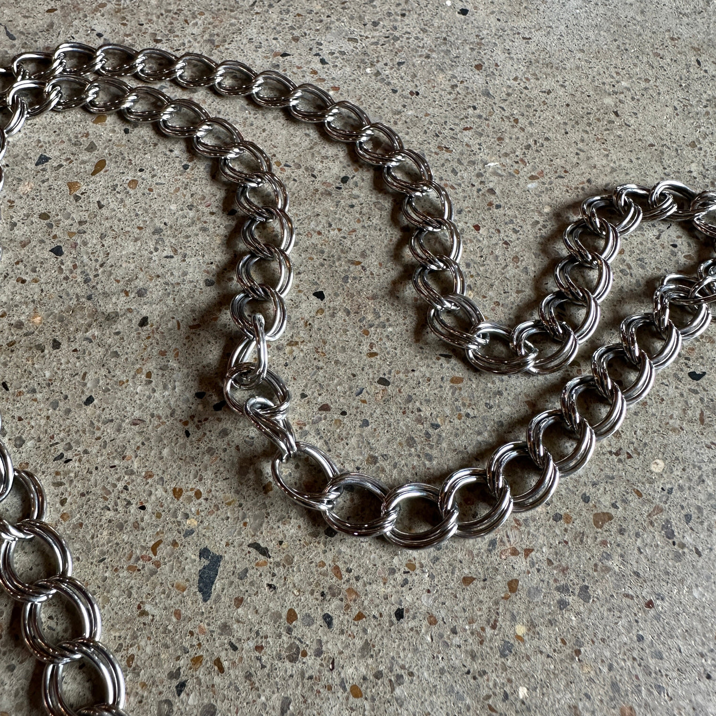 vintage silver chain belt with fleur-de-lis charm