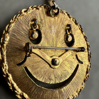 vintage smiley face brooch and pendant with articulated rhinestone eyes